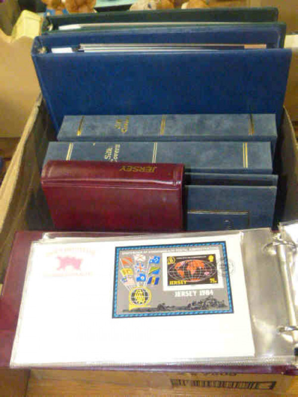 Jersey, Guernsey and Isle of Man first day covers, presentation packs and mint stamps in seven albums