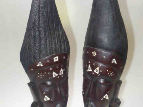 Pair of African carved wood busts with inlaid decoration