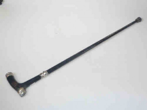 Ebonised walking stick with silver mount and collar