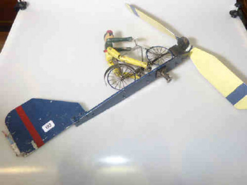 Garden weather vane in the form of a Gentleman riding a bicycle