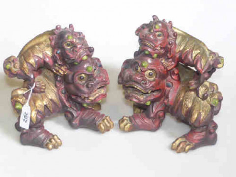 Pair Oriental carved wood and painted lion groups