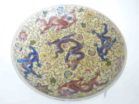 Pair large Oriental dishes decorated with dragons on flower and yellow...