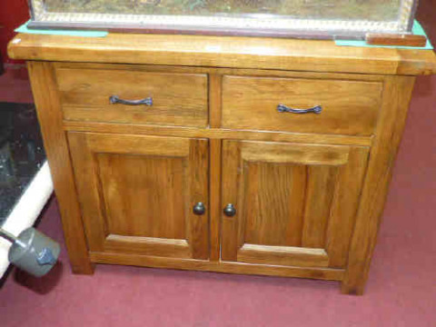 Rustic oak side cabinet having two drawers above double cupboard