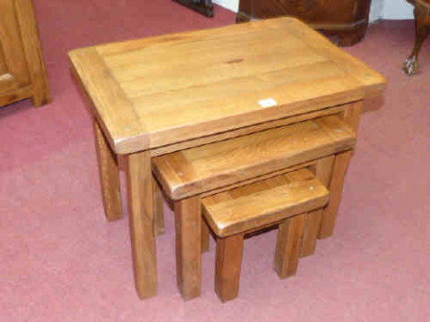 Rustic oak nest of three coffee tables