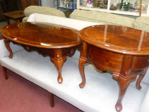 Walnut finish oval coffee table and small matching single drawer occasional...
