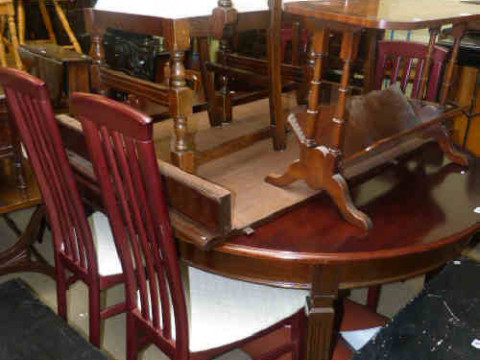 Mahogany extending dining table with three leaves, four mahogany finish...