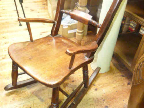 Child's mahogany rocking chair with turned stretcher