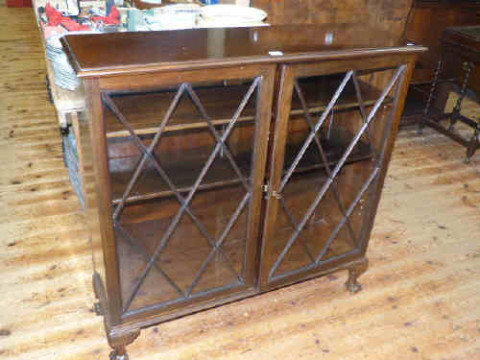 Mahogany astragal glazed double door bookcase on ball and claw feet
