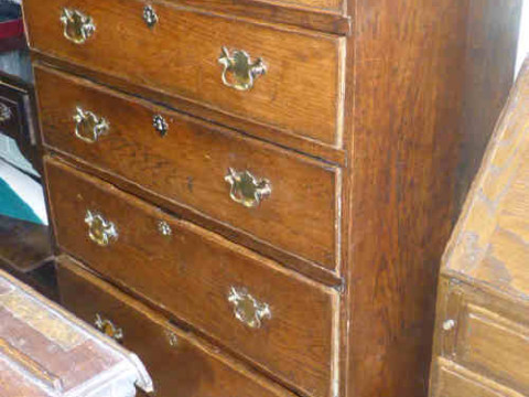 Georgian provincial oak five drawer chest on bracket feet with brass drop...