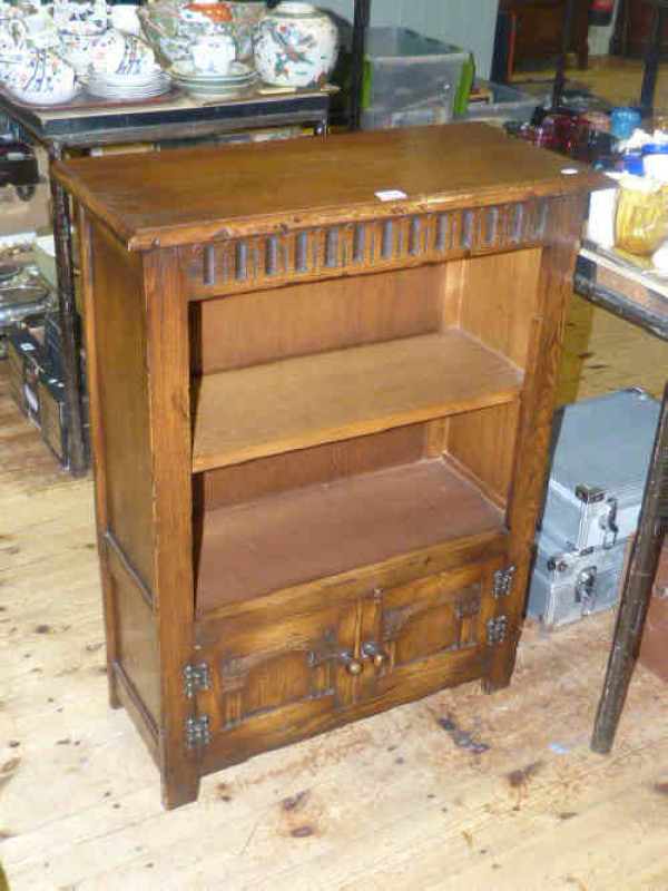 Small oak open bookcase with double door cupboard