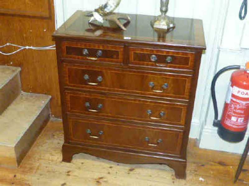 Inlaid mahogany four height chest