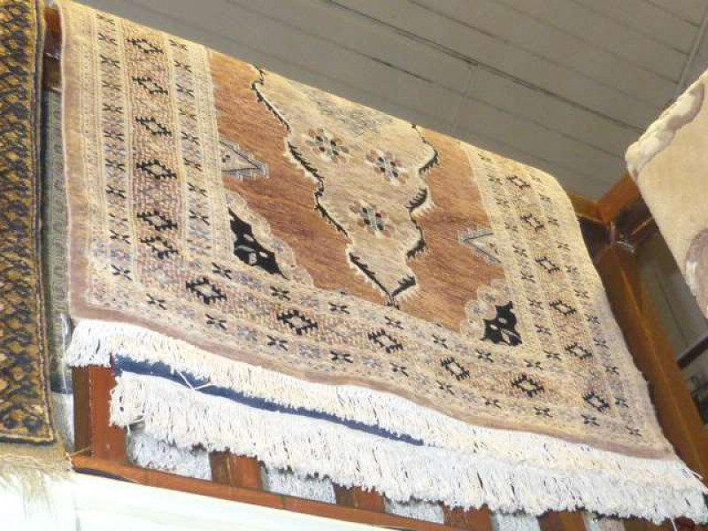 Brown ground Persian design rug and blue ground Persian design rug (2) 1.55 x 1.00 and 1.50 x 0.95