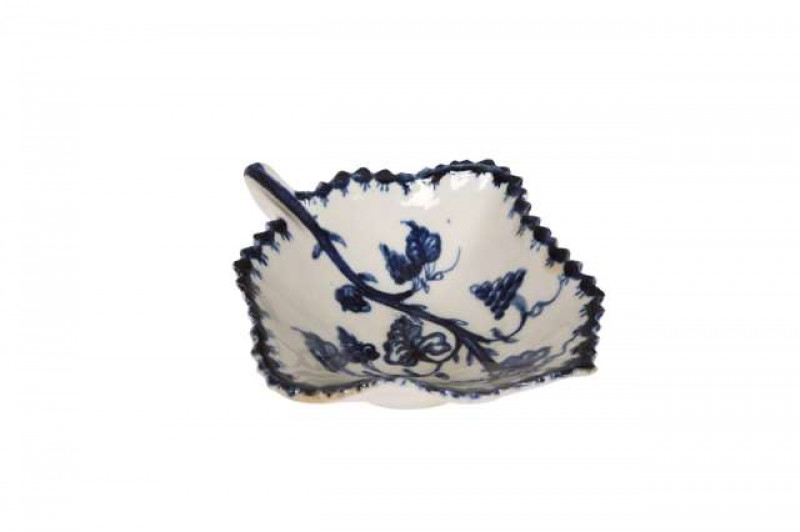 A Lowestoft pickle dish, c. 1770, leaf moulded and blue painted with fruiting vine. 9cm wide