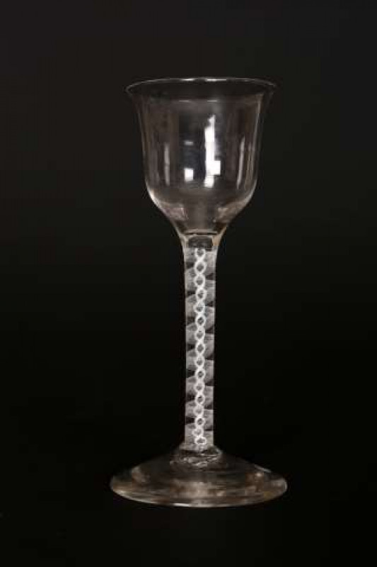 An 18th Century cotton twist wine glass, with flanged bowl. 14.5cm