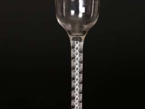 An 18th Century cotton twist wine glass, with flanged bowl. 14.5cm