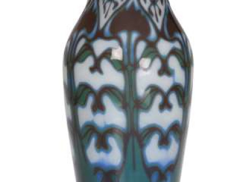 An Art Nouveau cased glass vase, decorated with stylised foliage in blue,...