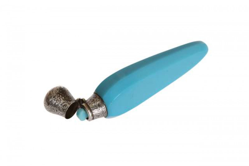 A Victorian turquoise glass scent flask, the tapering faceted body with engraved hinged cover (unmarked but probably silver), with original turquoise glass stopper. 13cm