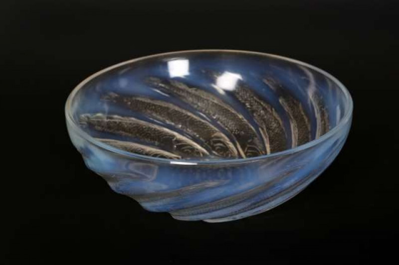 Poissons', a Lalique opalescent glass bowl, the exterior moulded with swirling fish, the centre with air bubbles, moulded R. LALIQUE mark. Diameter 24cm