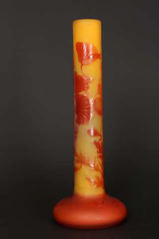 Emile Galle, Nancy, a 'Pavots' cameo glass vase, c.1904-06, the tall cylindrical stem issuing from a squat base, signed Galle with a star. 34cm