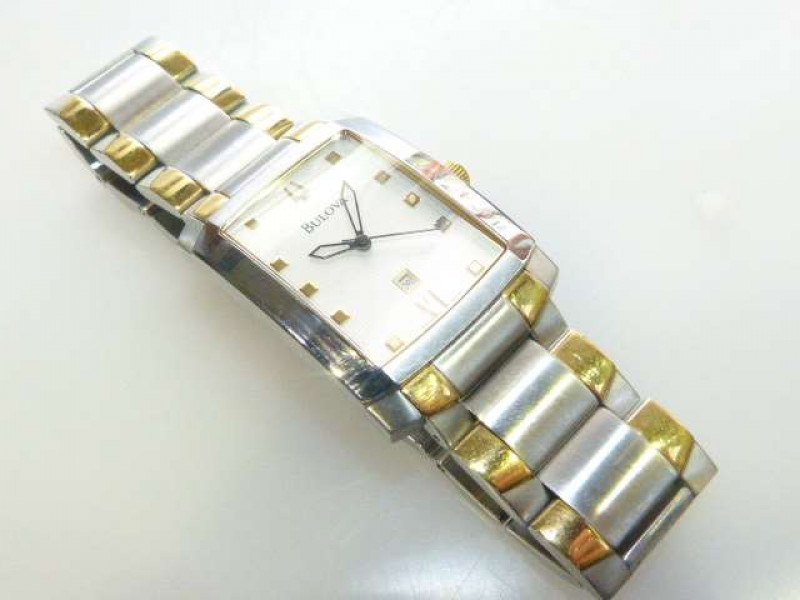 Gentleman's two colour metal wrist watch, signed Bulova, with centre sweep seconds and date aperture