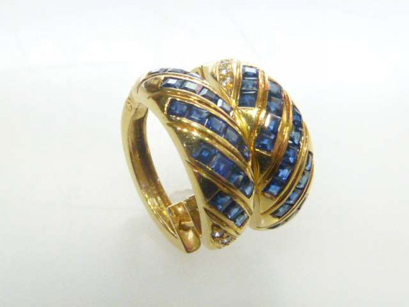 Pair of 18ct yellow gold and sapphire earrings, each hoop with channel set sapphires and diamonds, one stamped 750, 8 grams