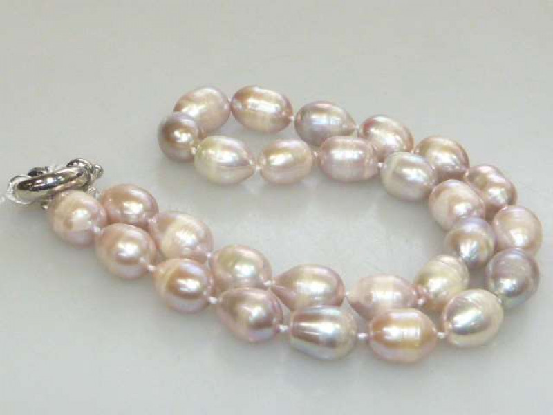 Lilac coloured freshwater pearl necklace, on a bolt ring clasp, length 47cm