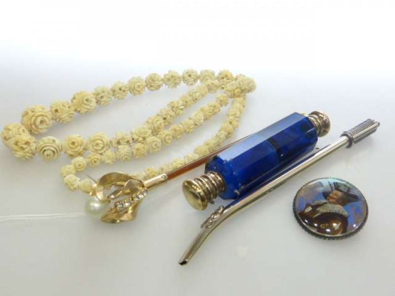 Double ended faceted scent bottle, graduated ivory bead necklace, Sterling silver 'laughing cavalier' brooch, etc