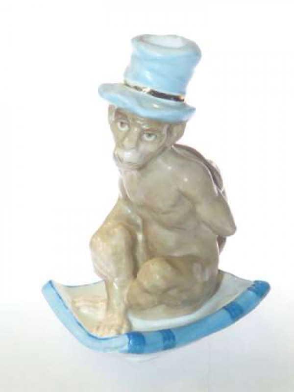 Continental porcelain monkey-form chamberstick