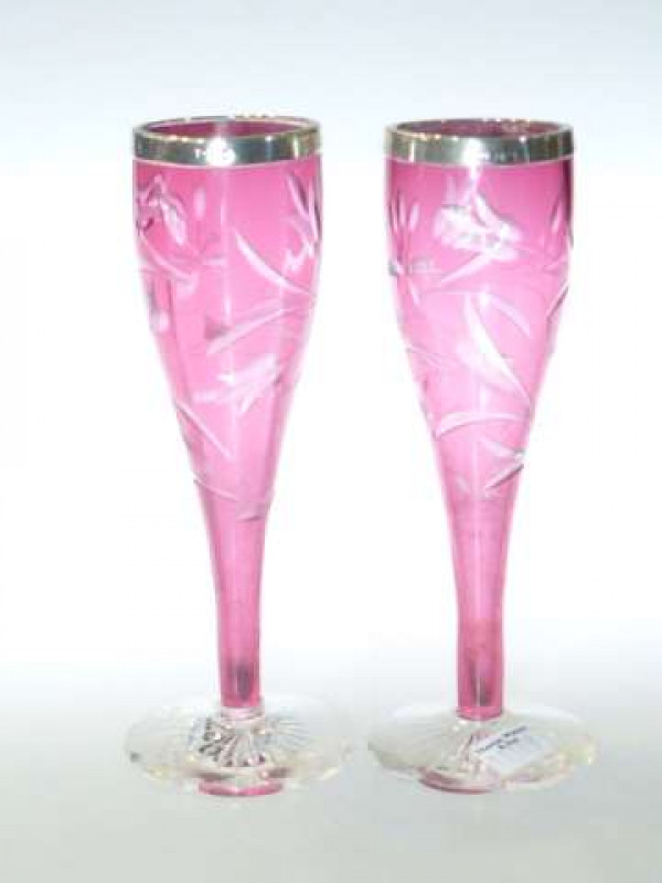 Pair of cut cranberry glass vases with silver rims