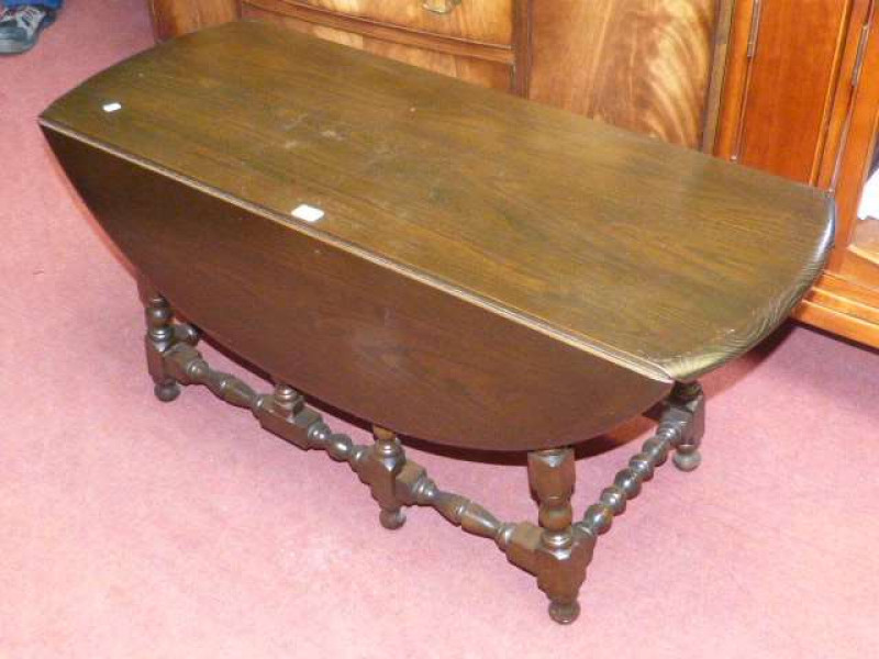 Dark oak Ercol drop leaf coffee table