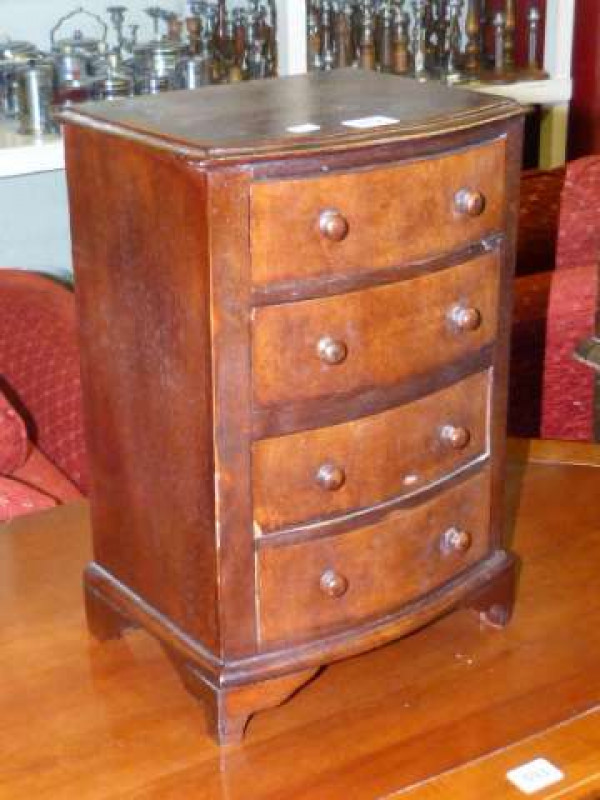 Miniature mahogany four drawer bow front chest