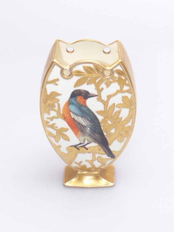 A Coalport vase, c. 1900, hand painted with a bird perched on a gilded bough, the reverse painted with butterfly and insects, gilded throughout, no. A5348, green printed factory mark. 16cm