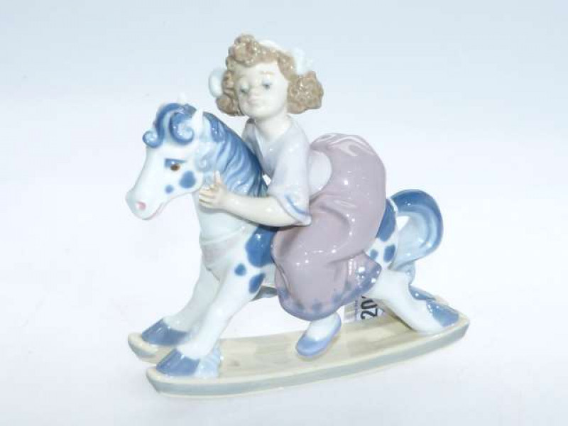 Lladro girl on rocking horse