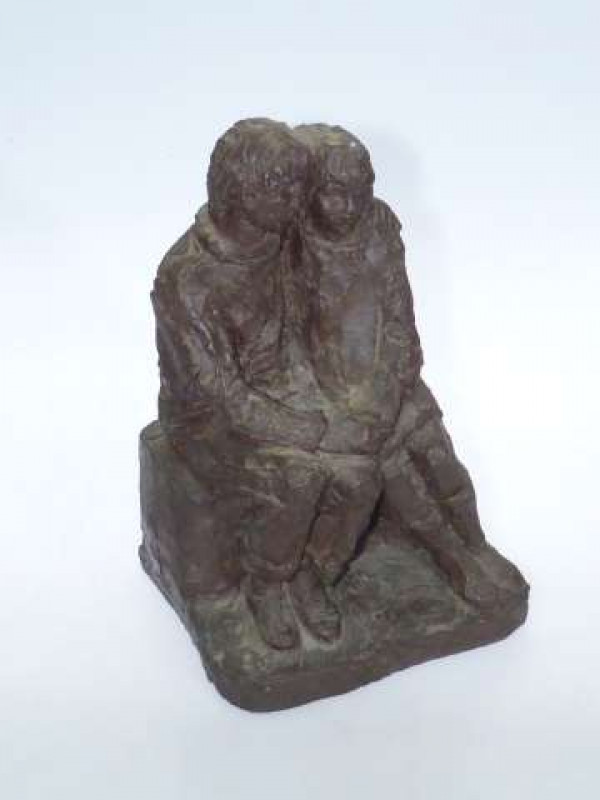 Bronze coloured resin sculpture of young lovers