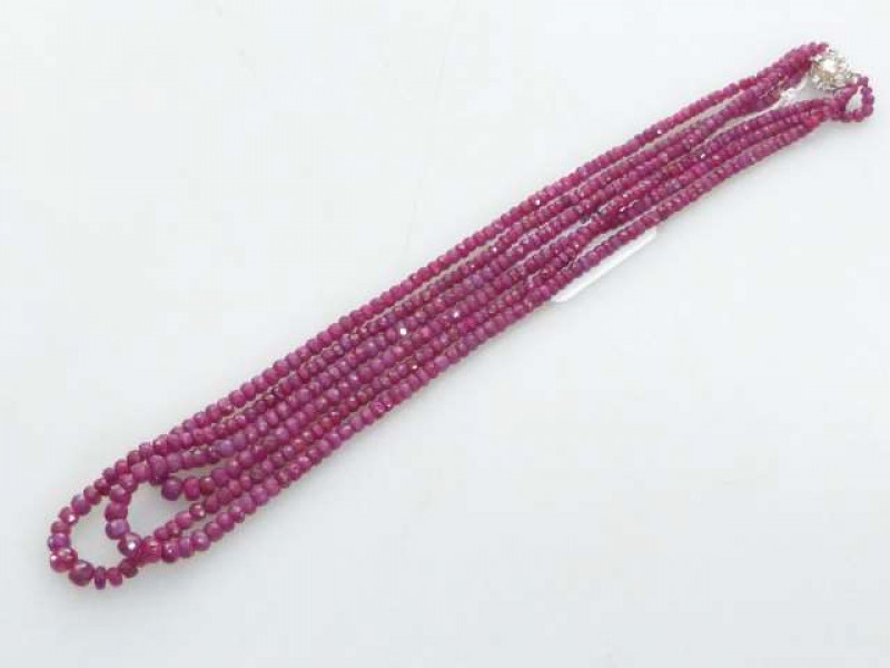Three strand ruby bead necklace with 18K white gold and diamond set clasp, approximate weight of rubies 175 carats