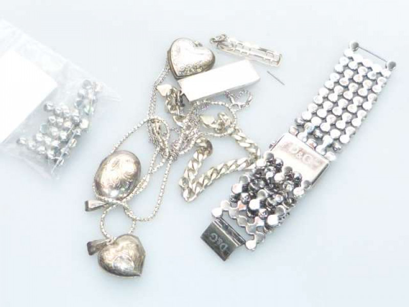 Bracelet watch, signed D & G; three lockets, etc