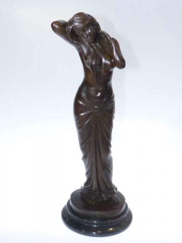 Bronze of a semi clad female, on marble plinth 42cm high