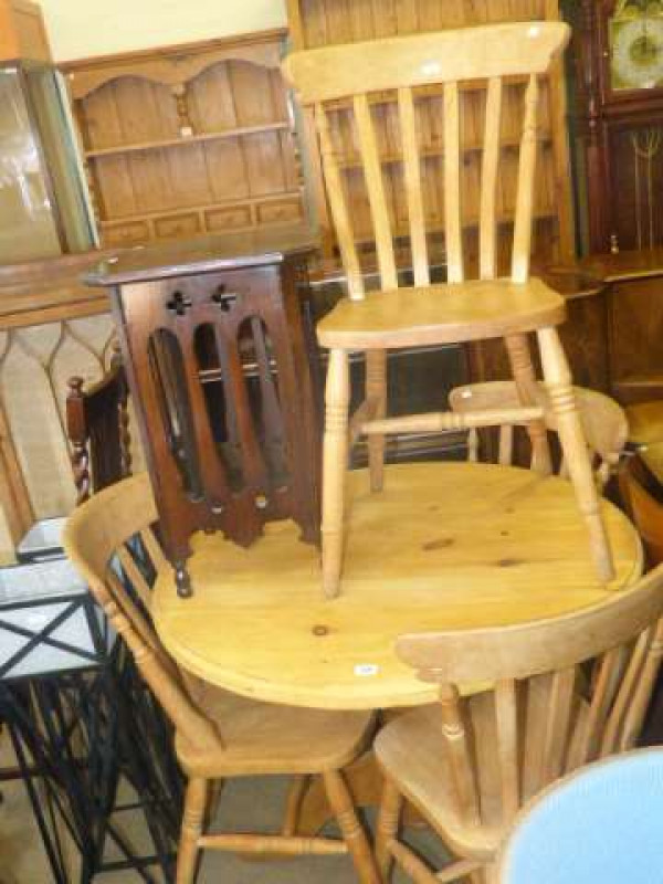 Circular pine pedestal dining table and four beech farmhouse style chairs