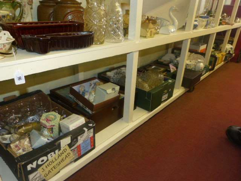 Full shelf of glass, china, ornaments, photograph frames, etc