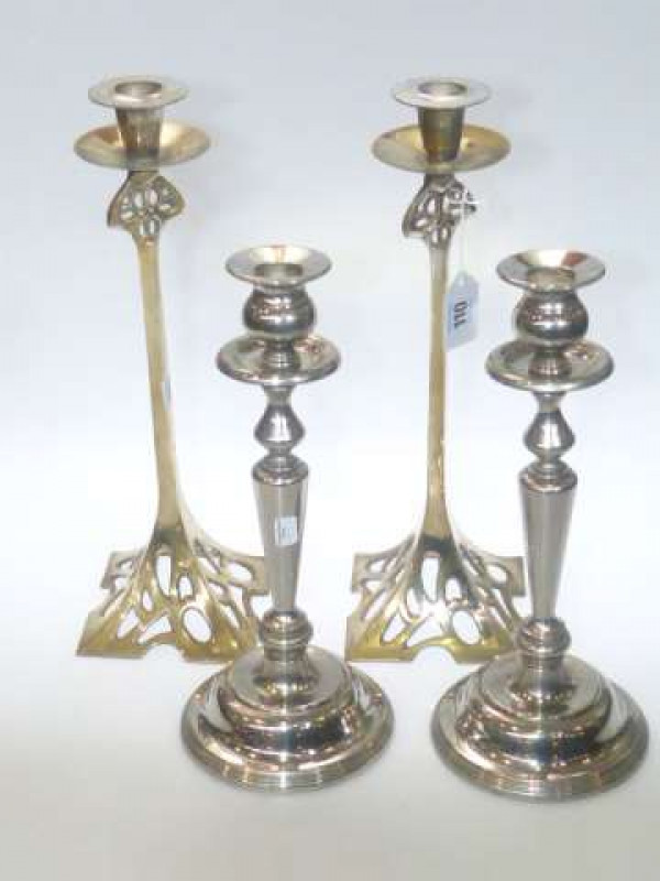 Pair of gilt metal Art Nouveau candlesticks and pair of silver plated candlesticks