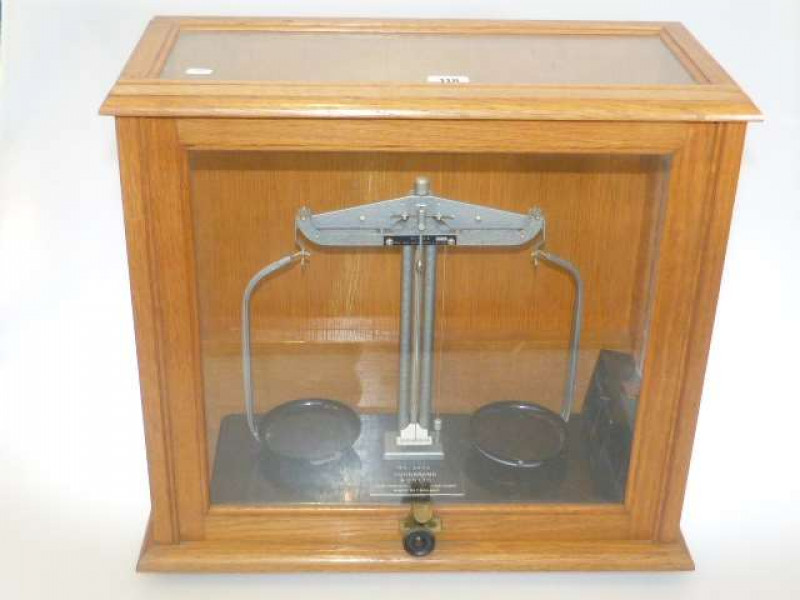 Goodbrand & Co Ltd balance scales and weights in glazed case