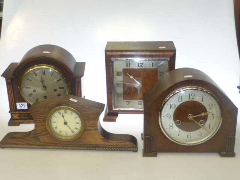 Four oak and walnut mantel clocks