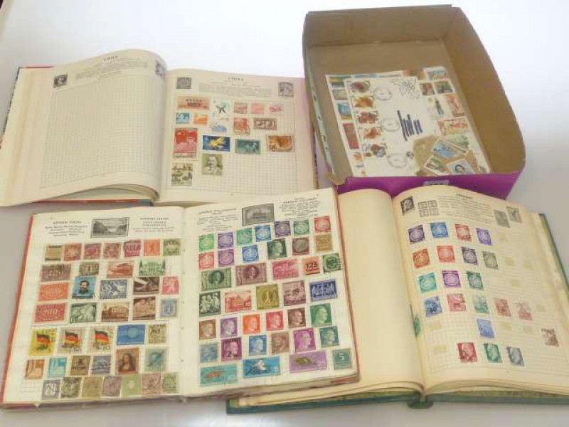 Three stamp albums and stamps