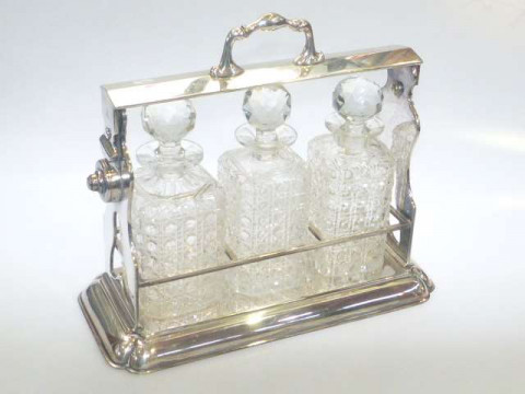 Silver plated three bottle tantalus