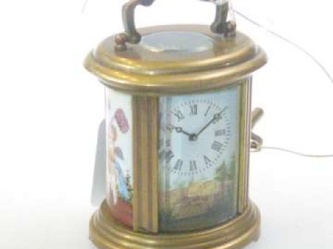 Small brass carriage clock with enamel painted side panels and face