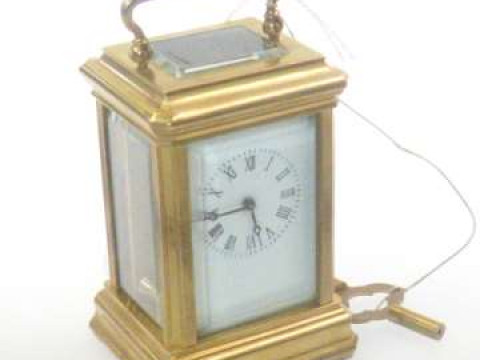 Small four glass panel carriage clock with enamel face