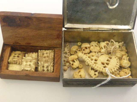 Collection of miniature ivory carvings in small inlaid brass and wood...