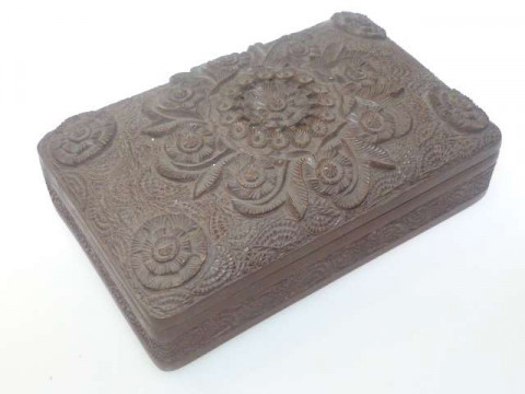 Heavily carved Indian teak cigarette box with floral design