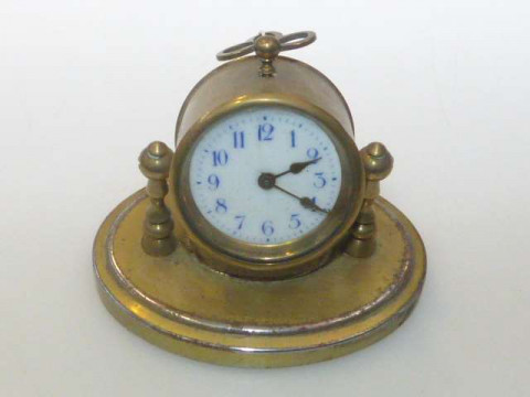 Brass swivel desk clock with enamelled dial