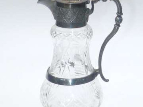 Cut glass claret jug with silver plated mount